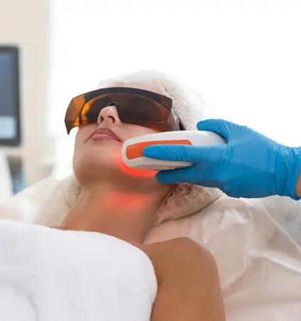 A person getting their face waxed at the spa