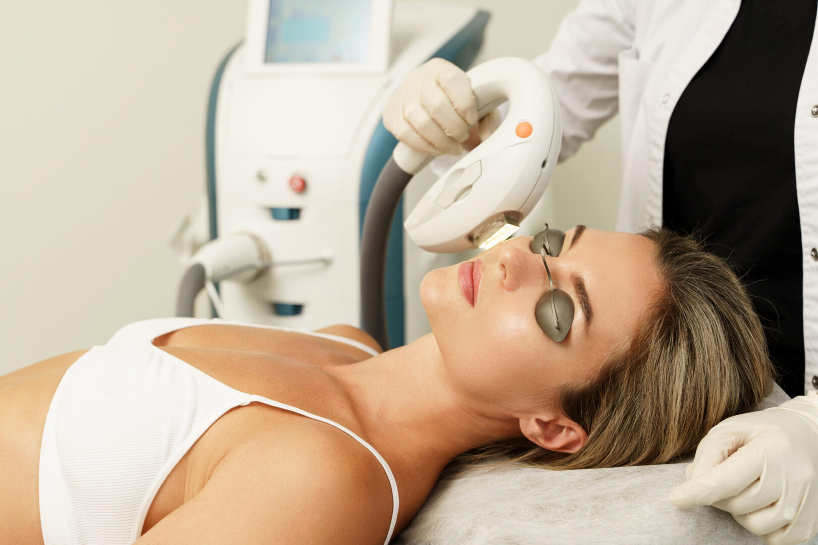 A woman getting her face waxed at the spa